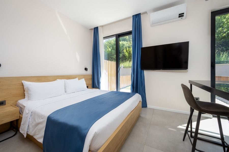 Studio with Forest View bedroom with a double bed, work table and garden-facing doors