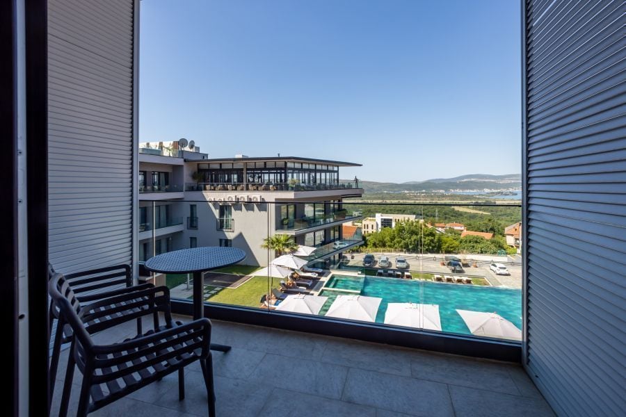 Studio with Sea View balcony overlooking the pool and the Bay