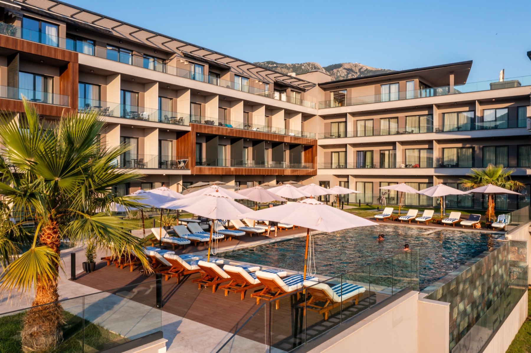 Royal Blue Resort and Residences pool courtyard with the residence buildings behind it