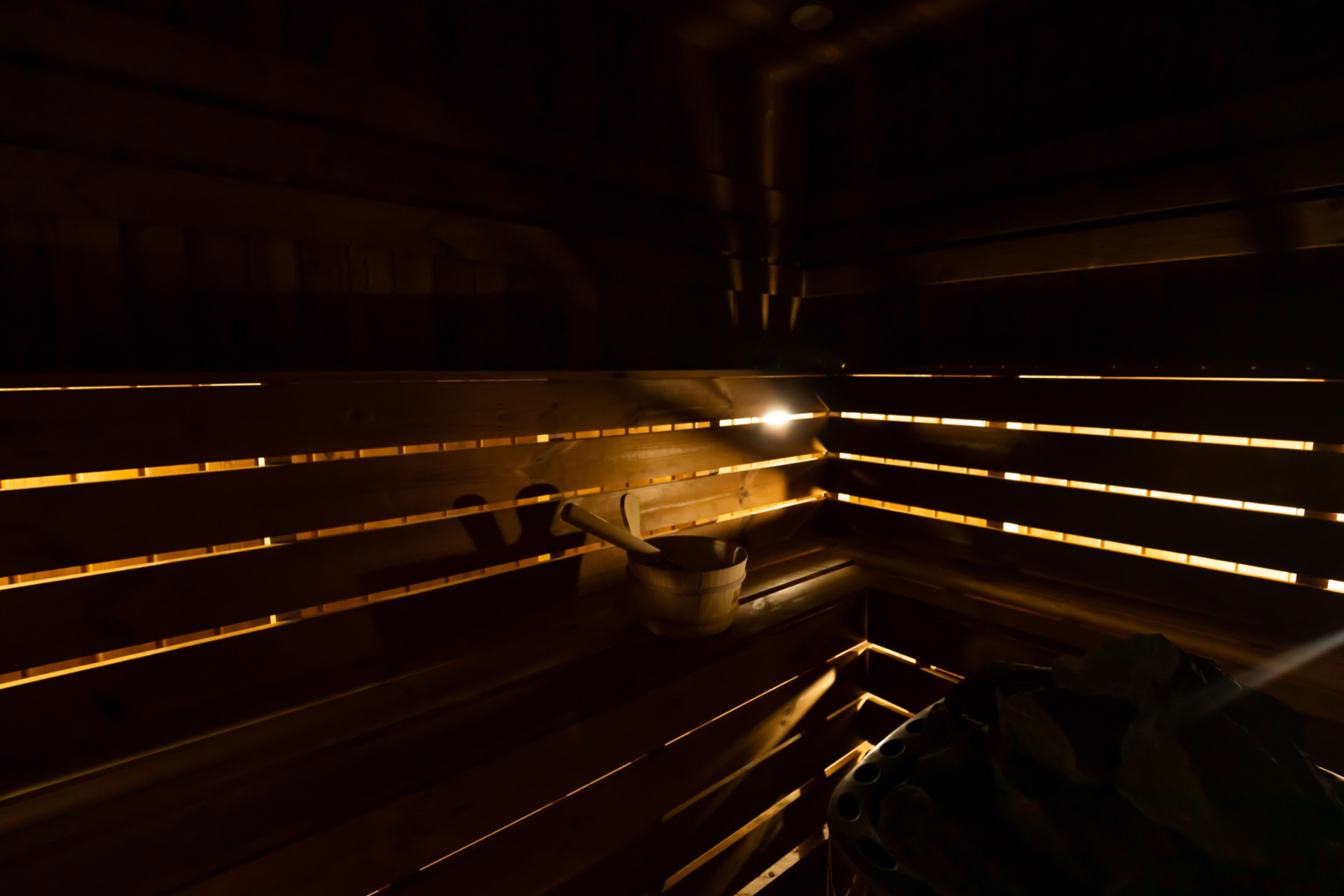 Warmly lit sauna inside the Royal Blue spa setting